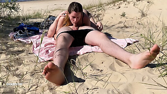 A Nude Couple Engages In Oral Sex On A Beach